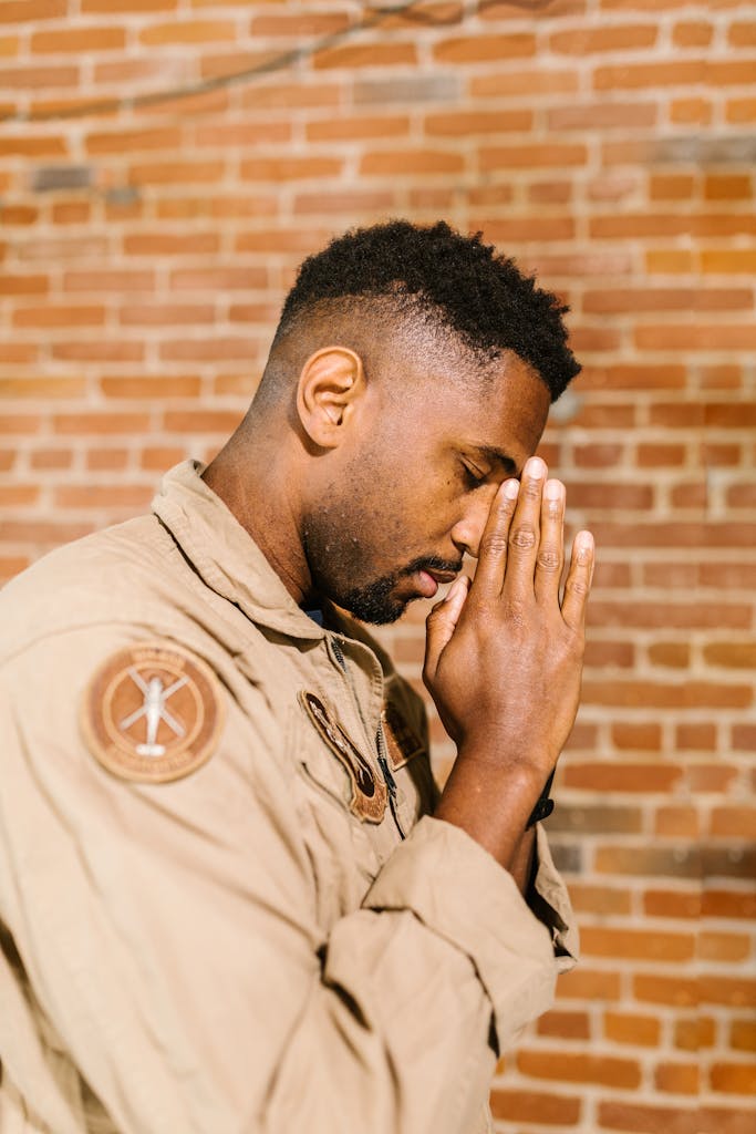 Side View Photo of Praying Man