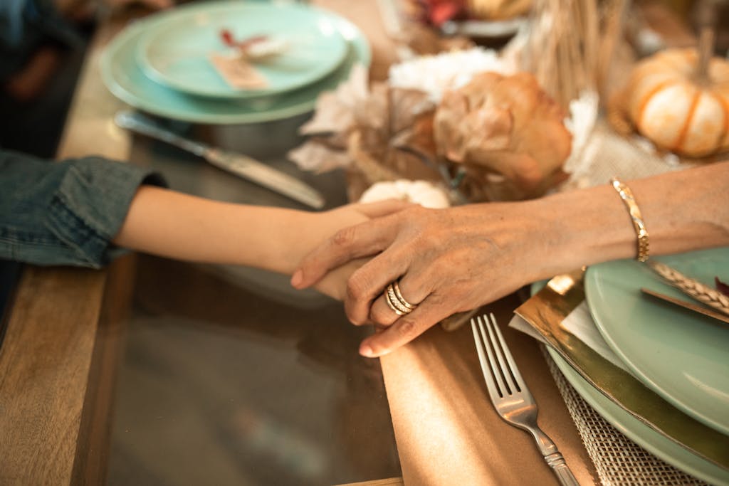 Person Holding Silver Fork and Bread Knife